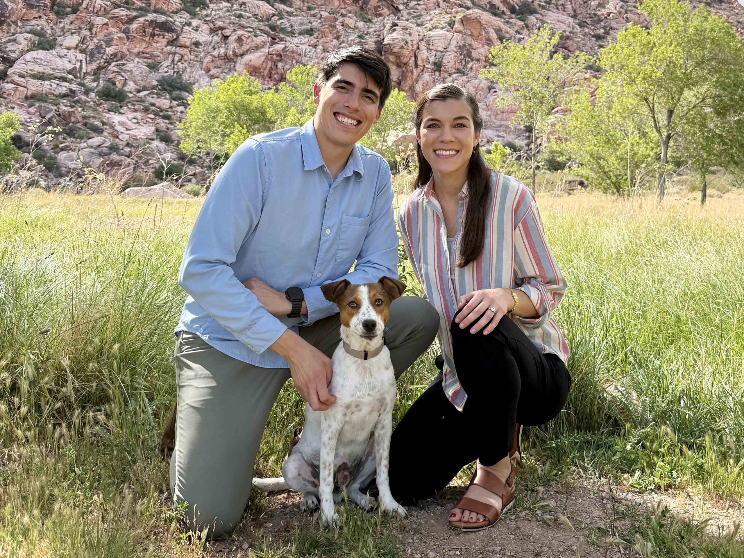 Dr. Martinez and Dr. Edwards with their dog outdoors