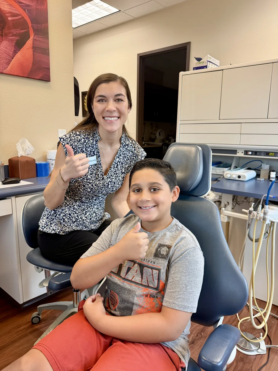 Dr Edwards Henderson Pediatric Dentist With Child In Dental Chair